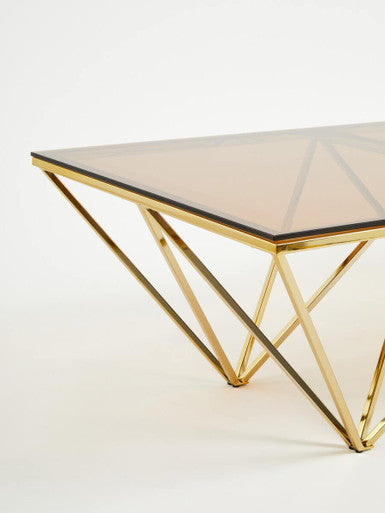 Red-Tinted Tempered Glass Top Coffee Table With Geometric Prismatic Champagne Metal Legs, Allure