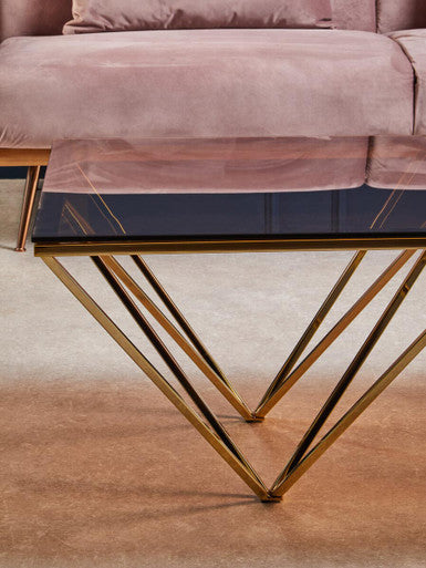 Red-Tinted Tempered Glass Top Coffee Table With Geometric Prismatic Champagne Metal Legs, Allure